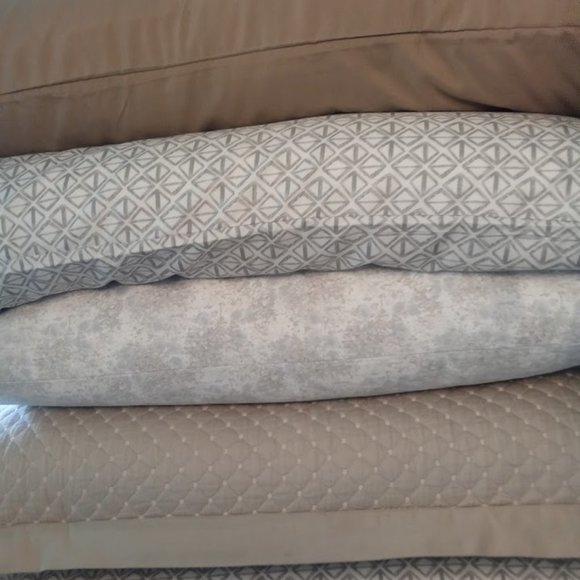 Arrangement of vibrant pillowcases in shades in creams and tans.